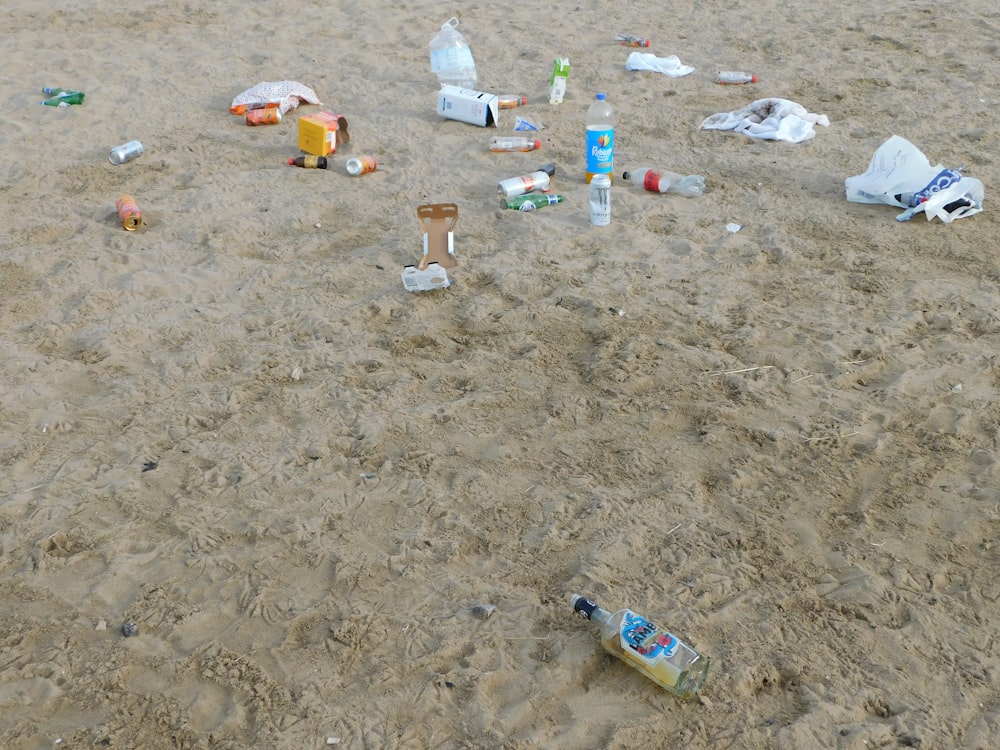 a group of objects on a sandy area