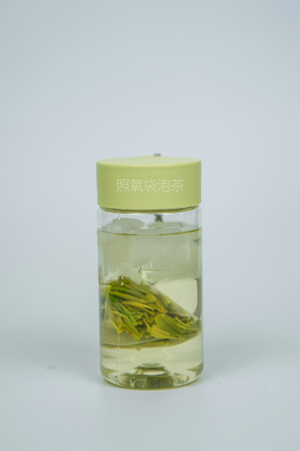 a glass jar with a yellow substance
