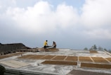 a man standing on a roof