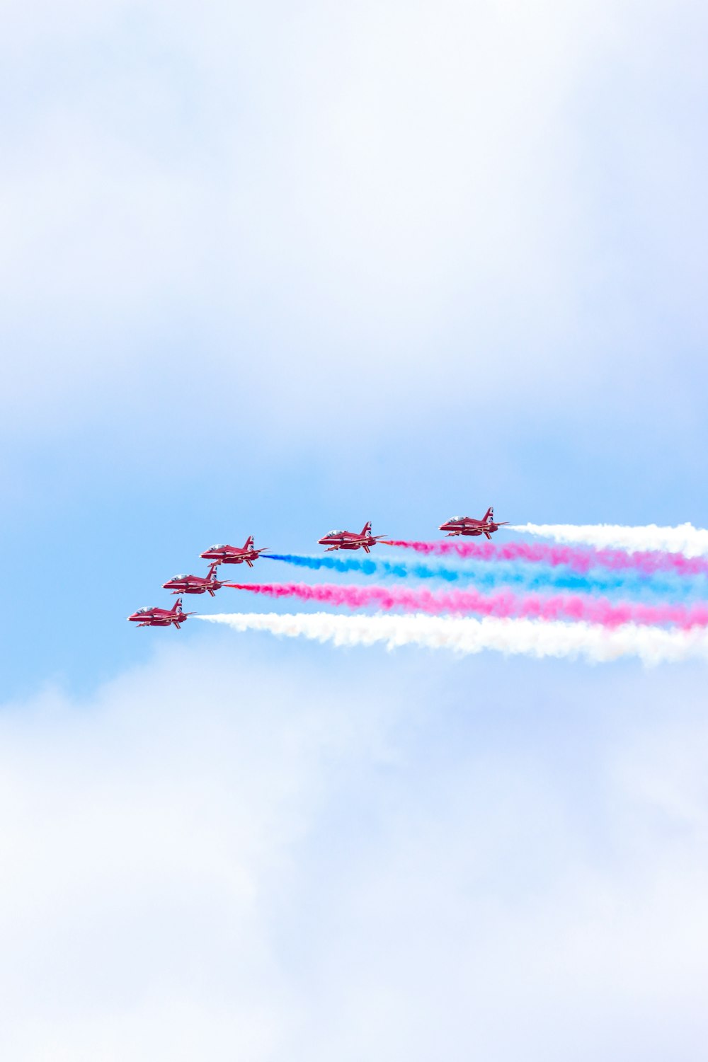 a group of airplanes flying in formation