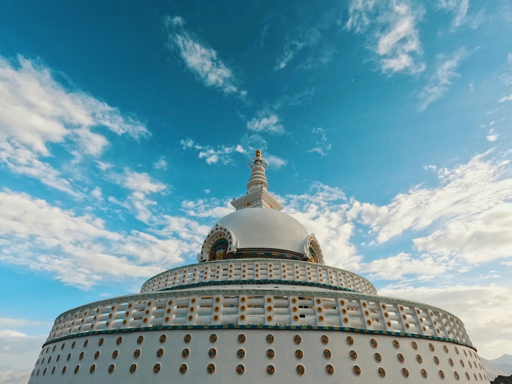 a domed building with a statue on top