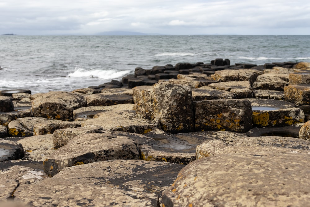 a rocky beach with waves crashing