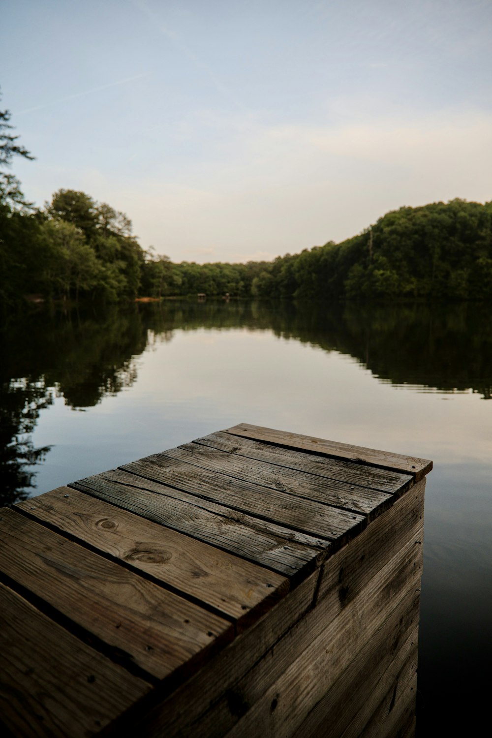a wooden dock on a lake