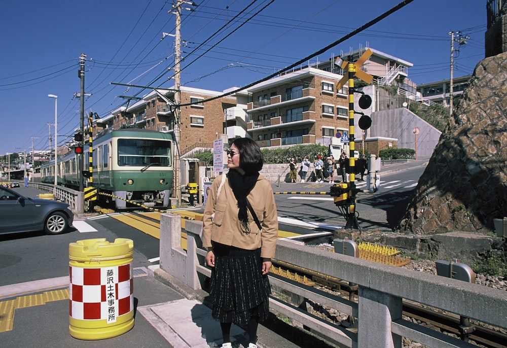 a person standing on a sidewalk