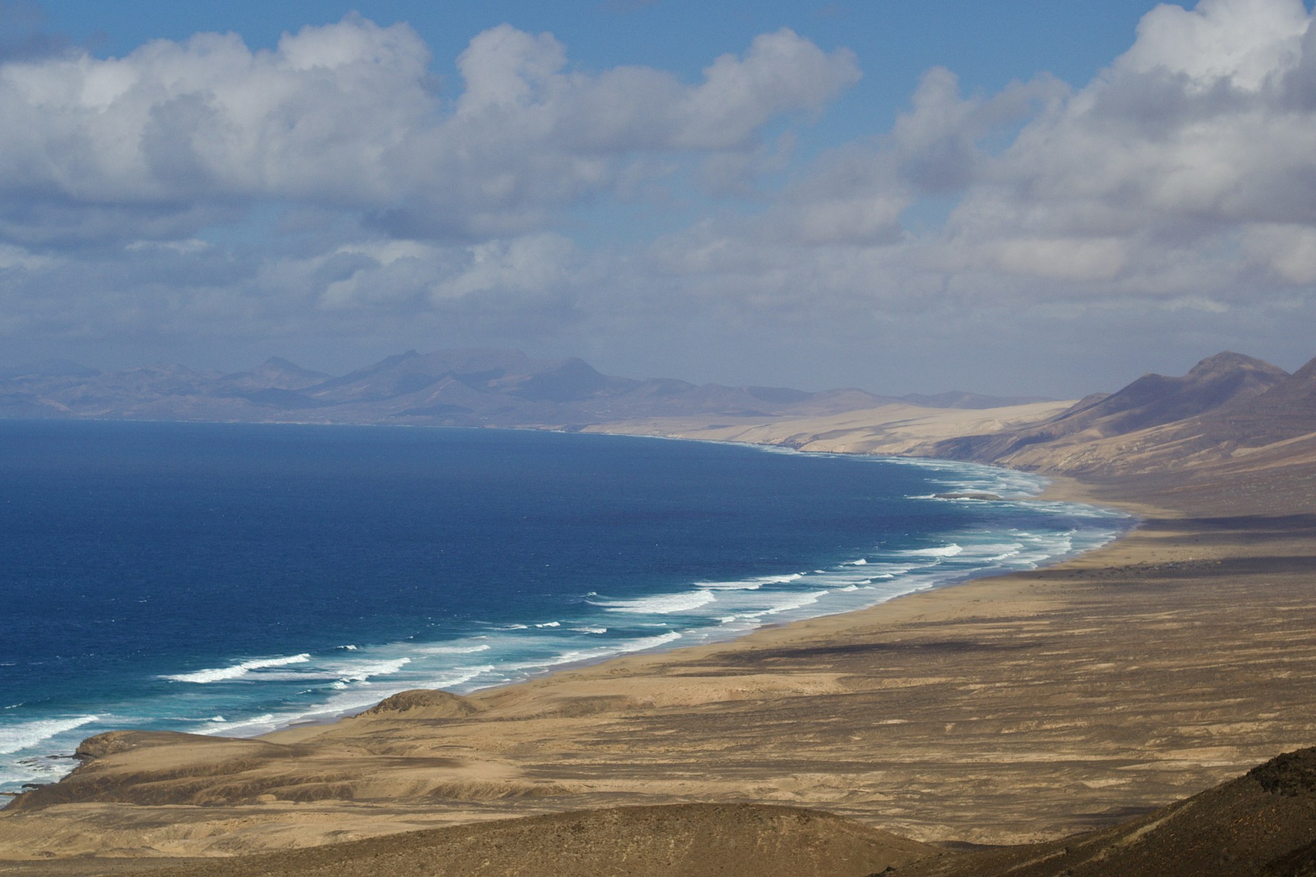 a beach with a body of water