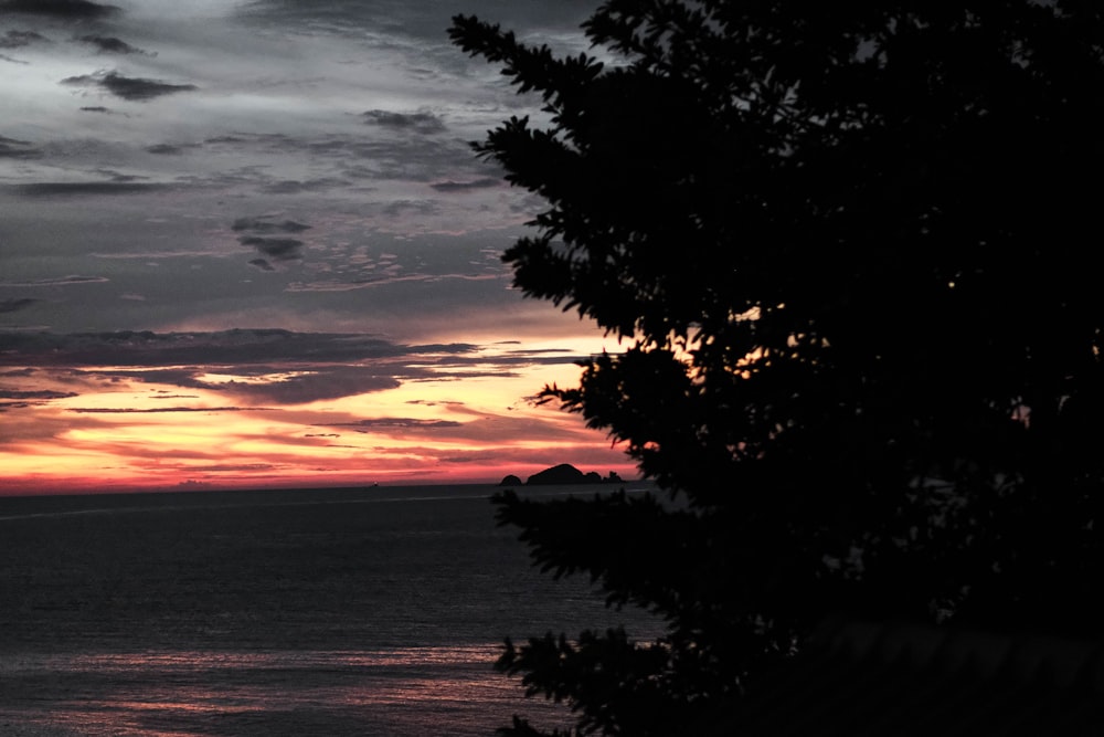 a sunset over a body of water