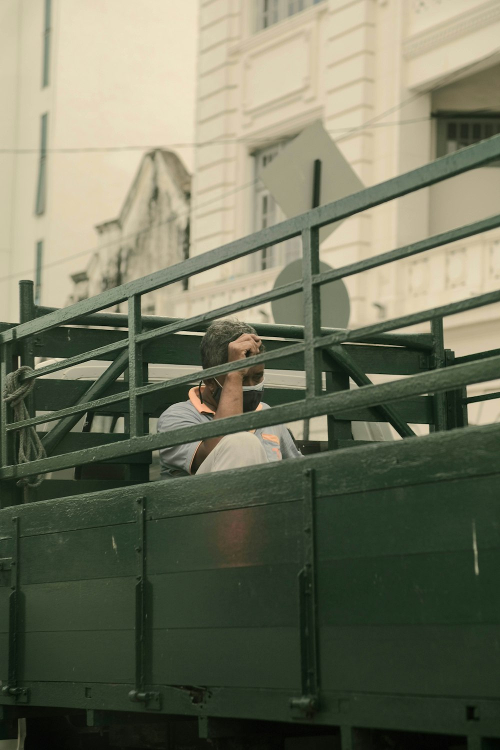 a person leaning on a railing