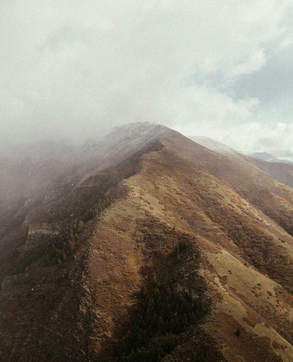 a mountain with a valley below