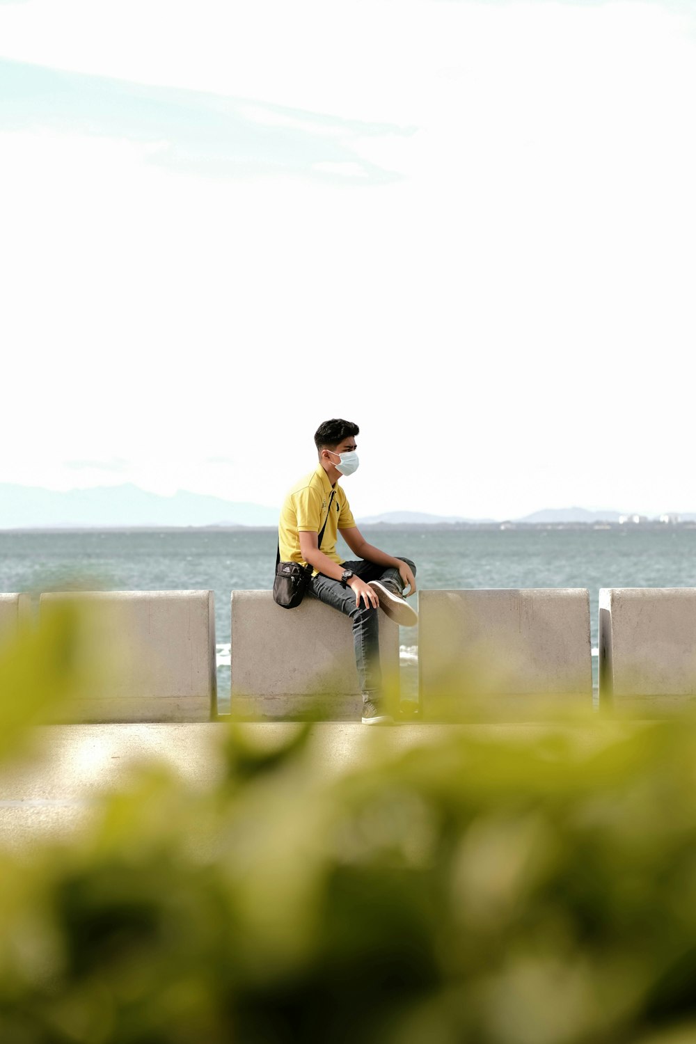 a man sitting on a ledge