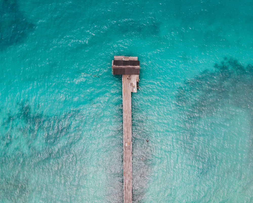 a wooden post in the water