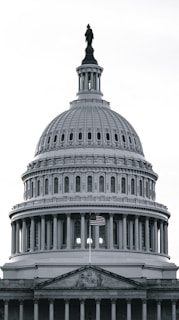 a large white building with a statue on top