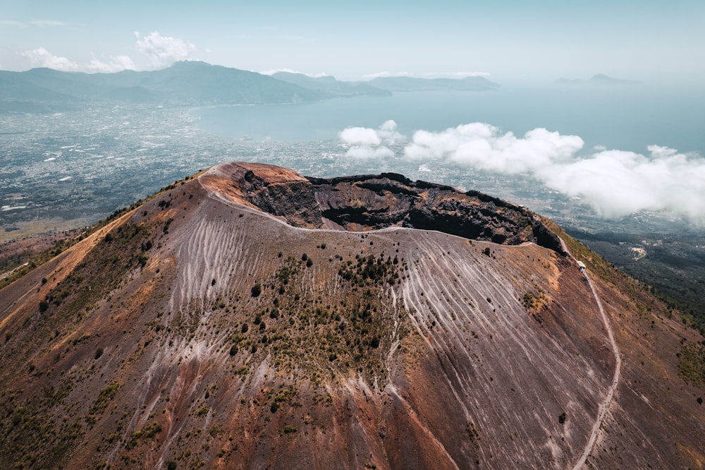 a large rocky hill with a road