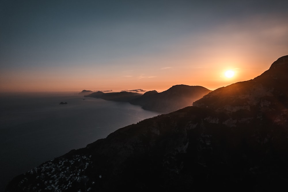 a sunset over a body of water