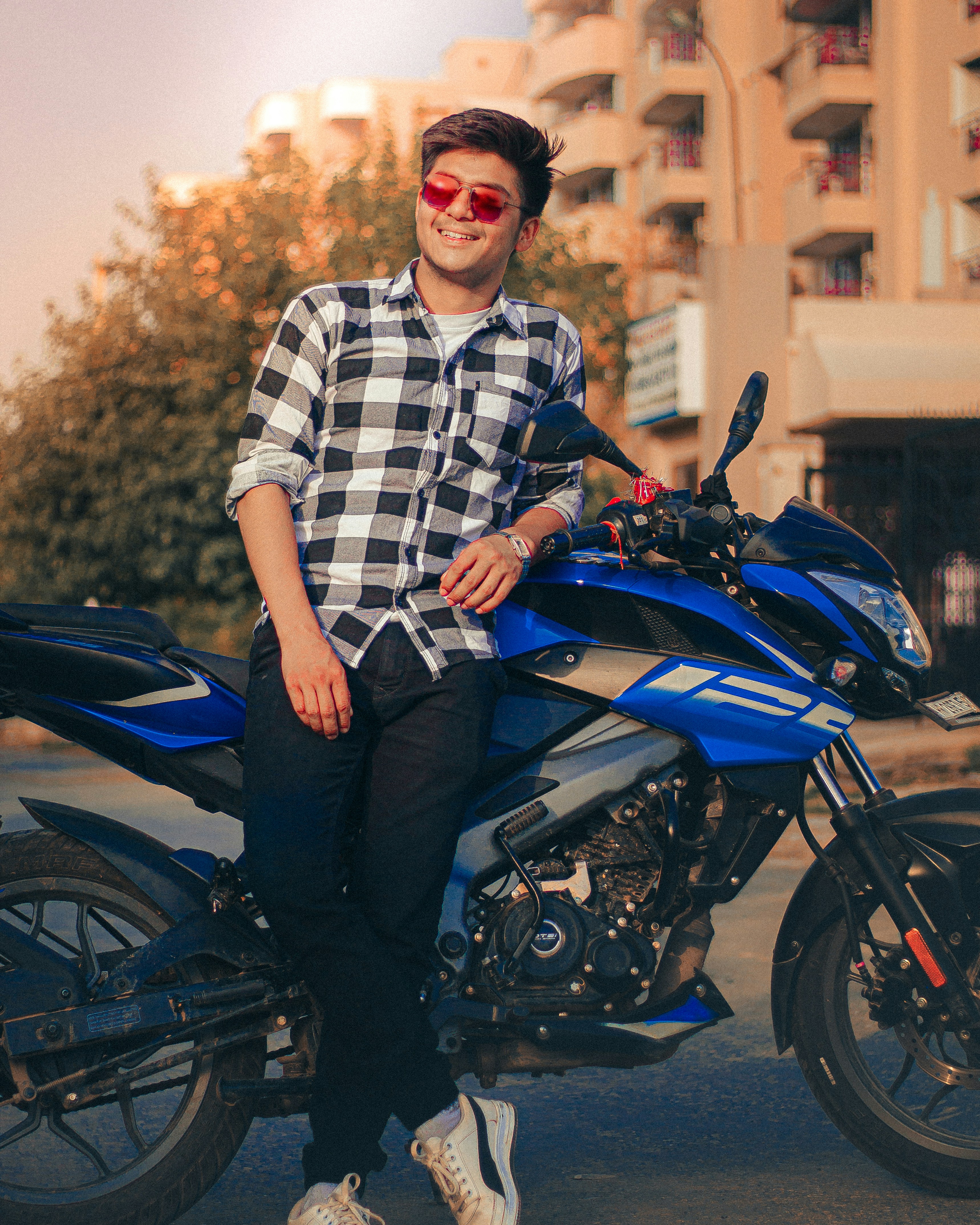 a man sitting on a motorcycle