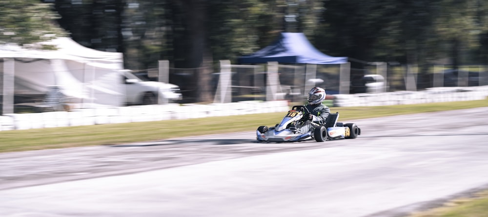 a person driving a go kart