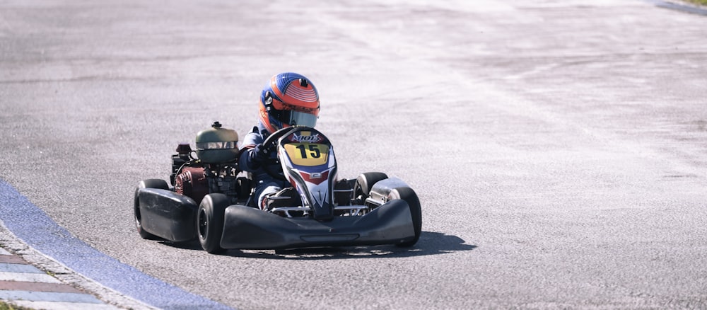 a person driving a go kart