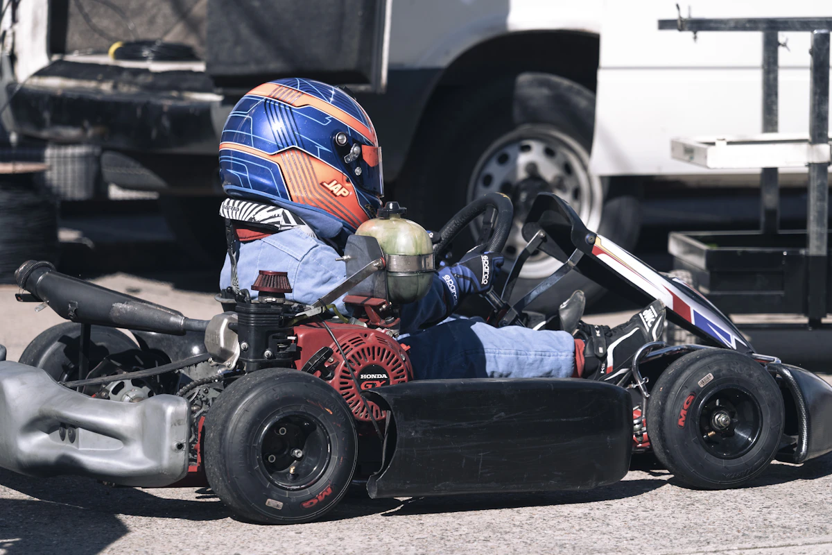 Go-kart racer speeding through an entertainment track