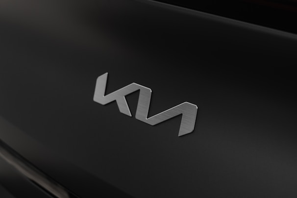 Close-up of a futuristic logo design on a black matte background