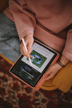 a person holding a tablet