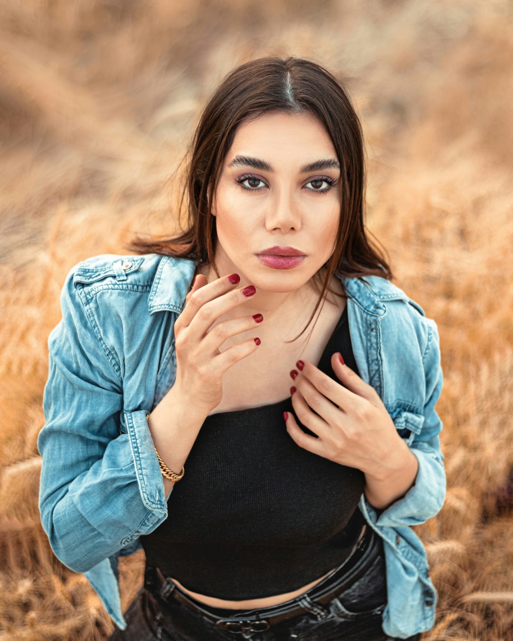 a woman with her hands on her chin