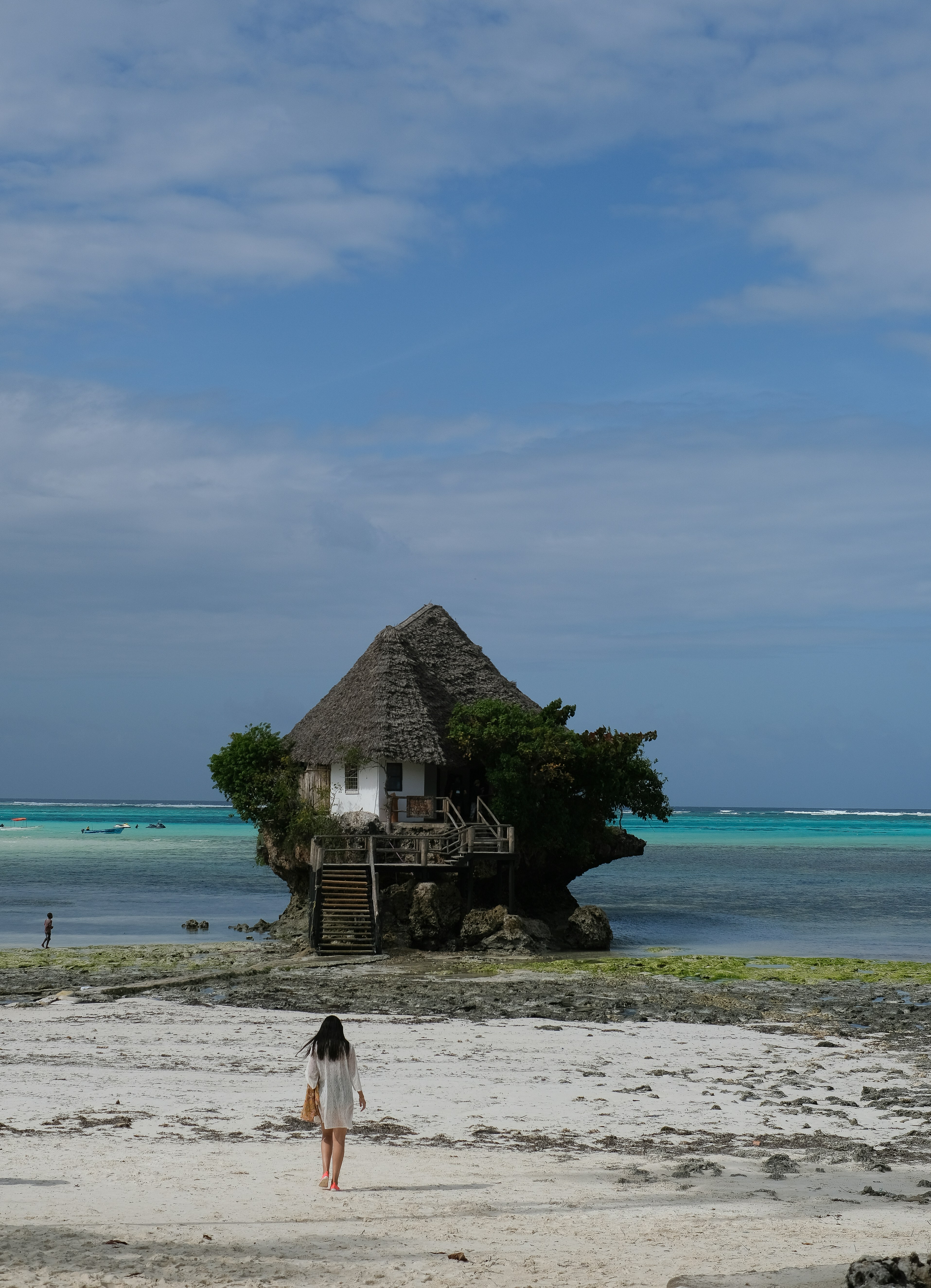a person walking on a beach