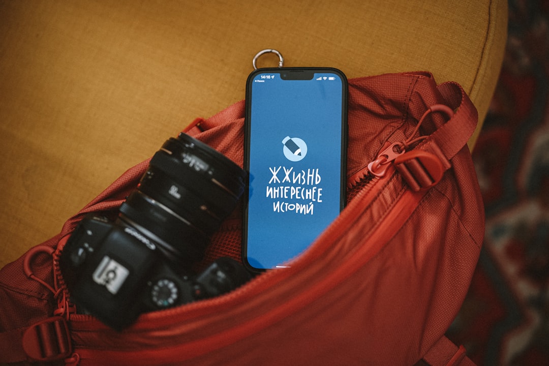 a cell phone on a red jacket,