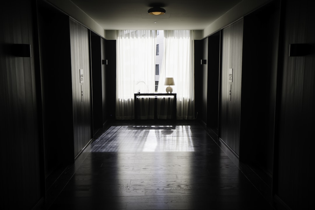 a hallway with a wood floor, Elevator hallway at the Reykjavik EDITION