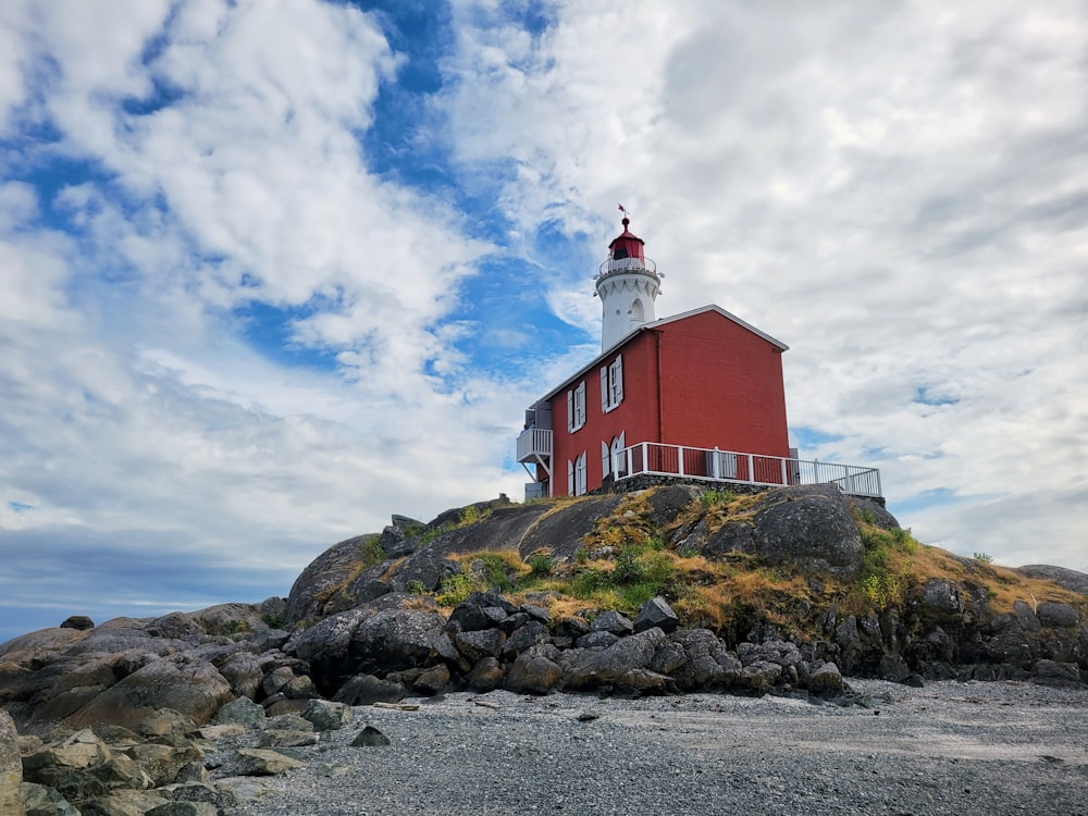 a lighthouse on a rocky hill