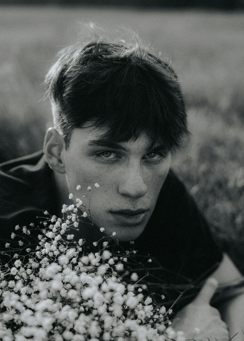 a person with a bush of flowers