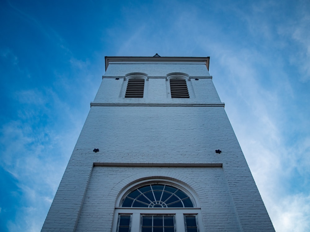 a tall white building with windows