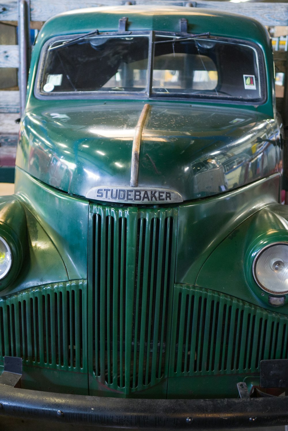 a green truck with a metal frame