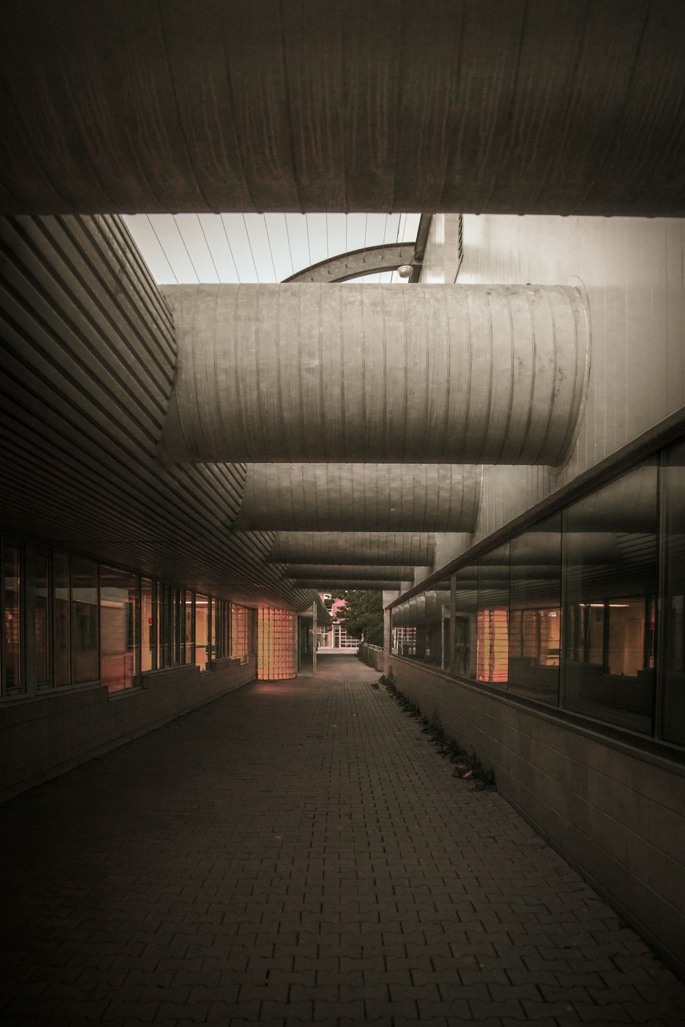 a walkway with a covered walkway