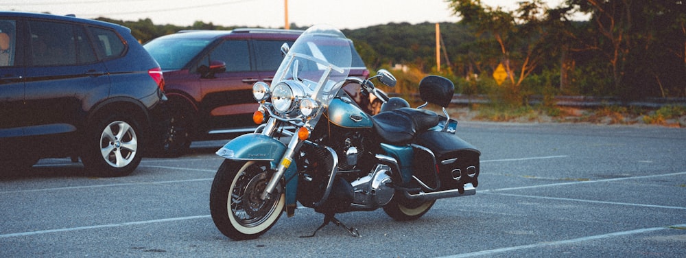 a person riding a motorcycle in a parking lot