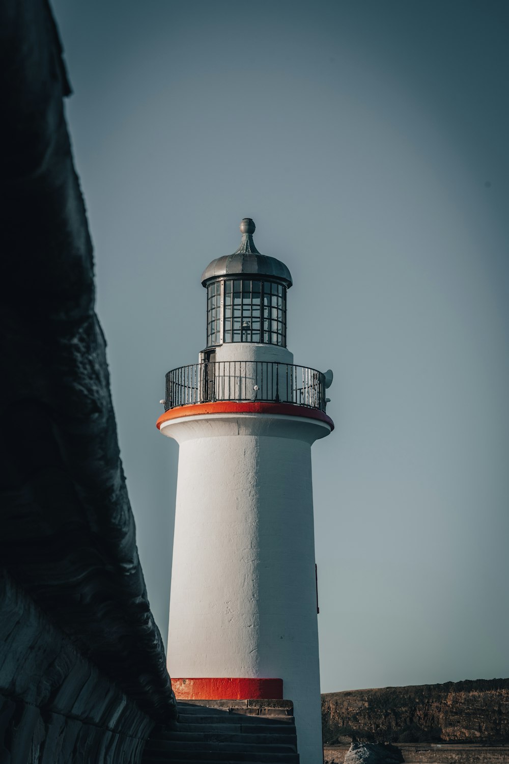 a lighthouse on a hill