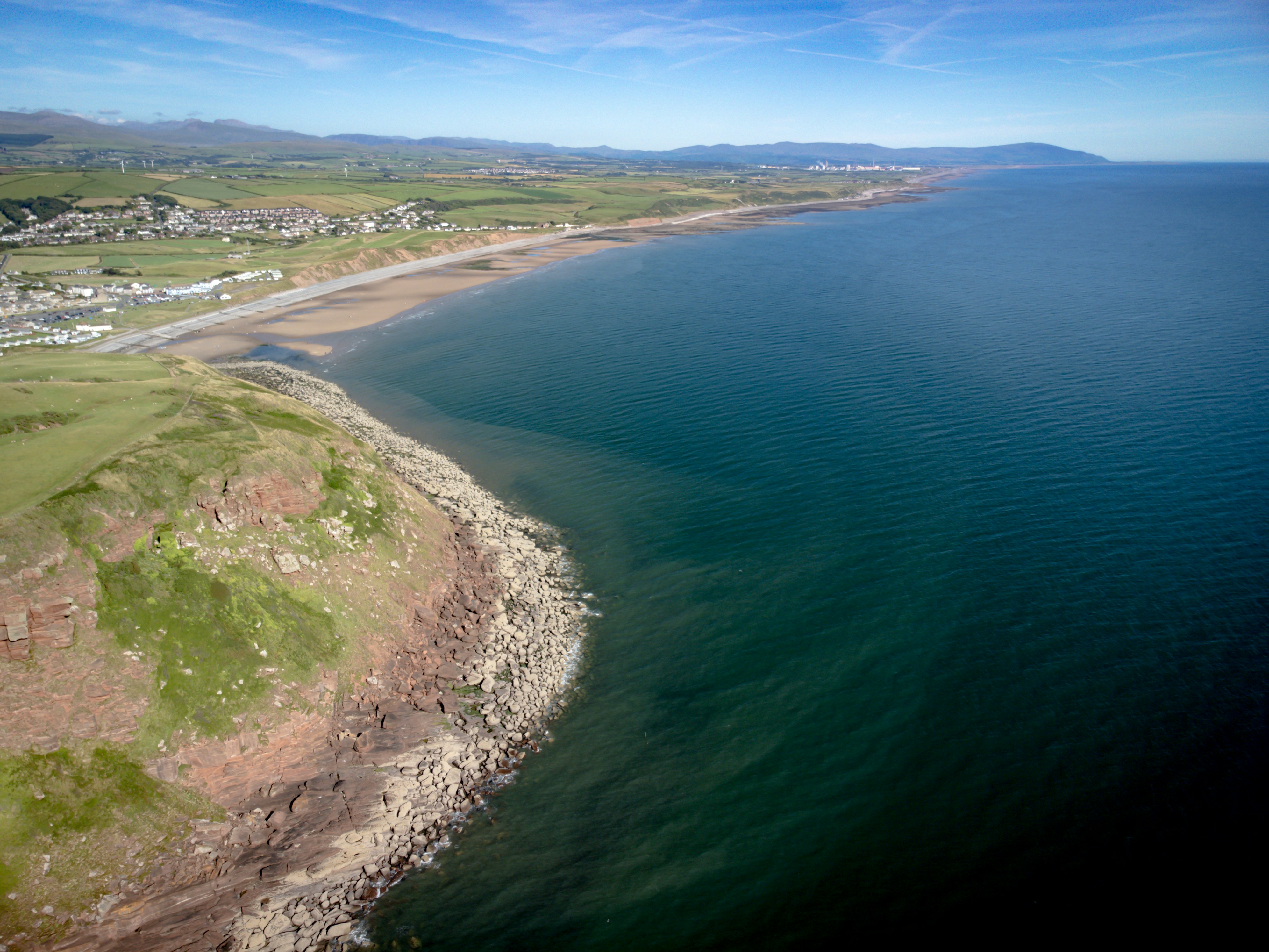 a beach with a body of water