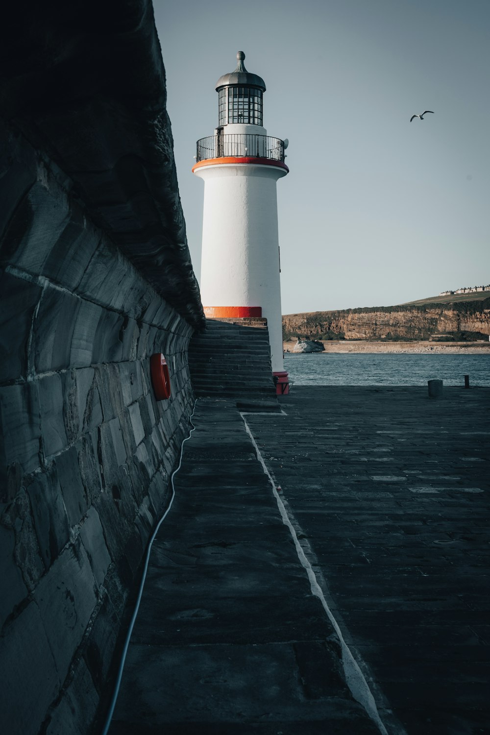 a lighthouse on a pier