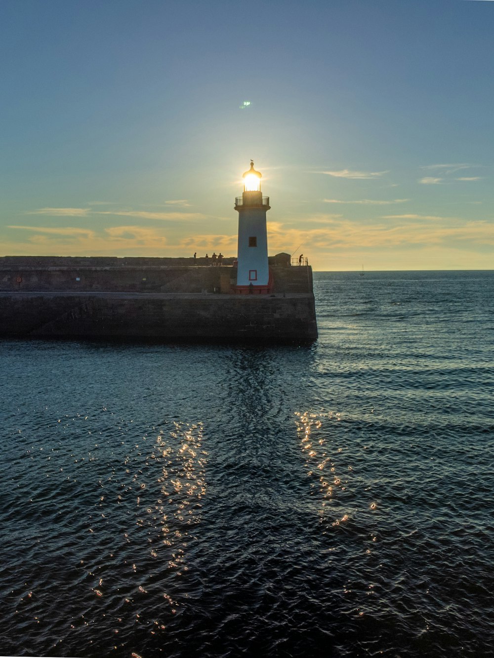 a lighthouse on a pier