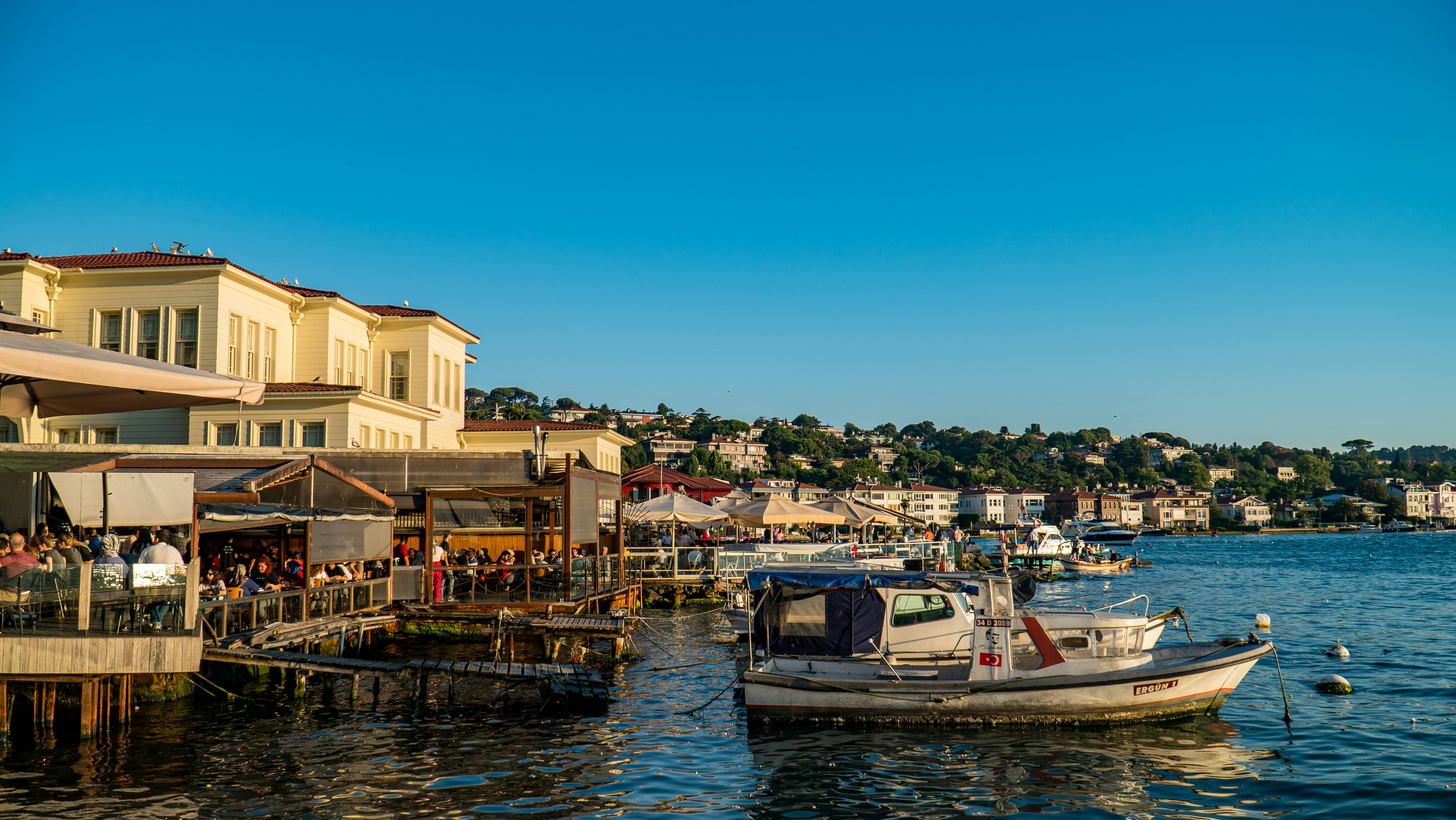 a boat docked at a pier, 