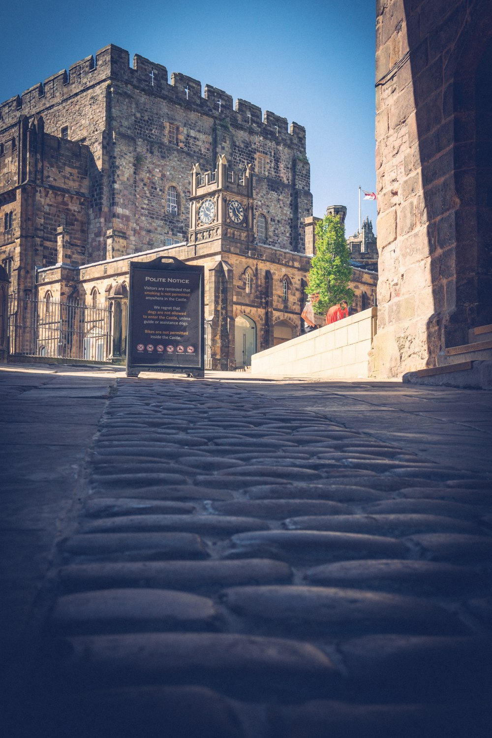 a stone building with a sign on it