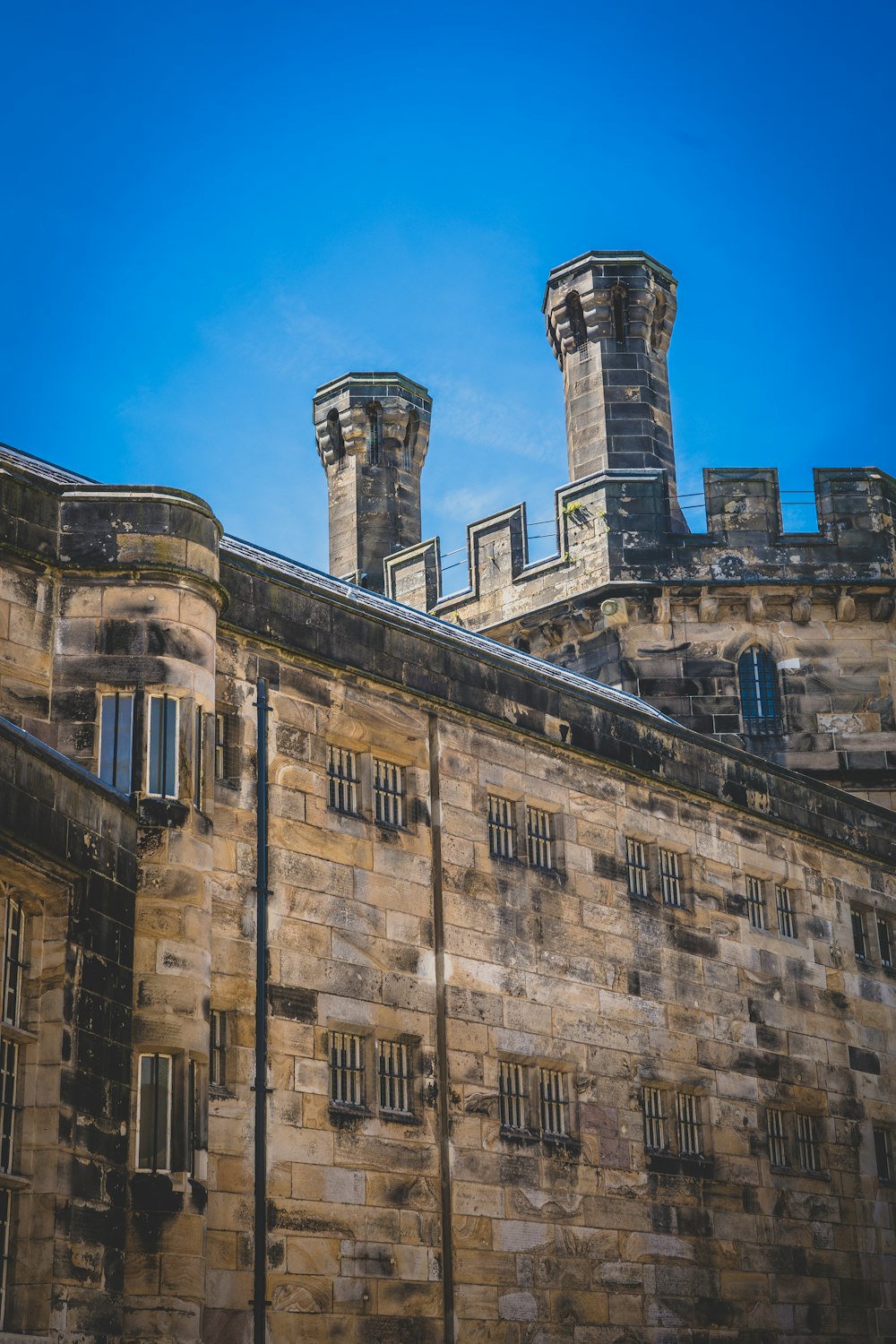 a stone building with towers