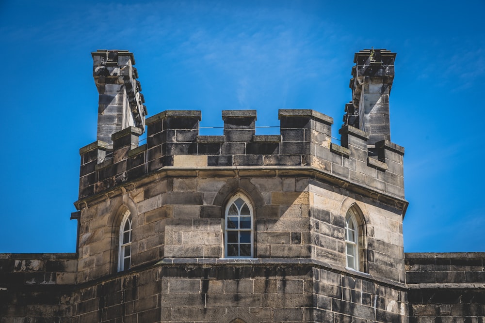 a stone building with towers