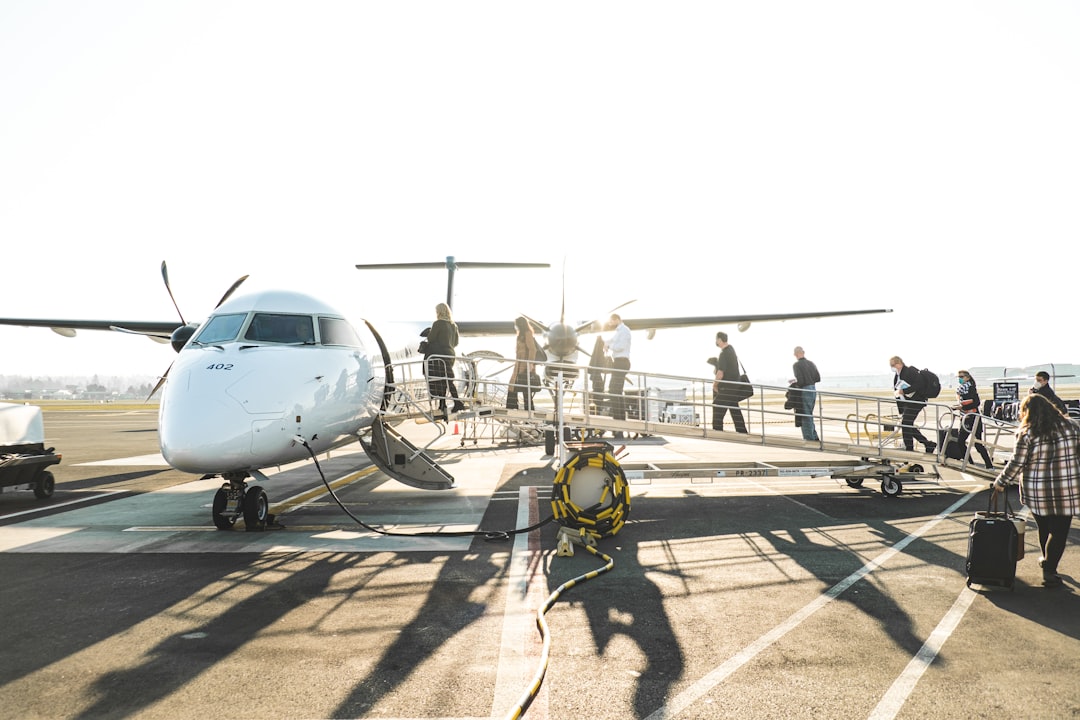 people boarding a plane,