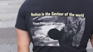 a person wearing a black shirt with a graphic design on it