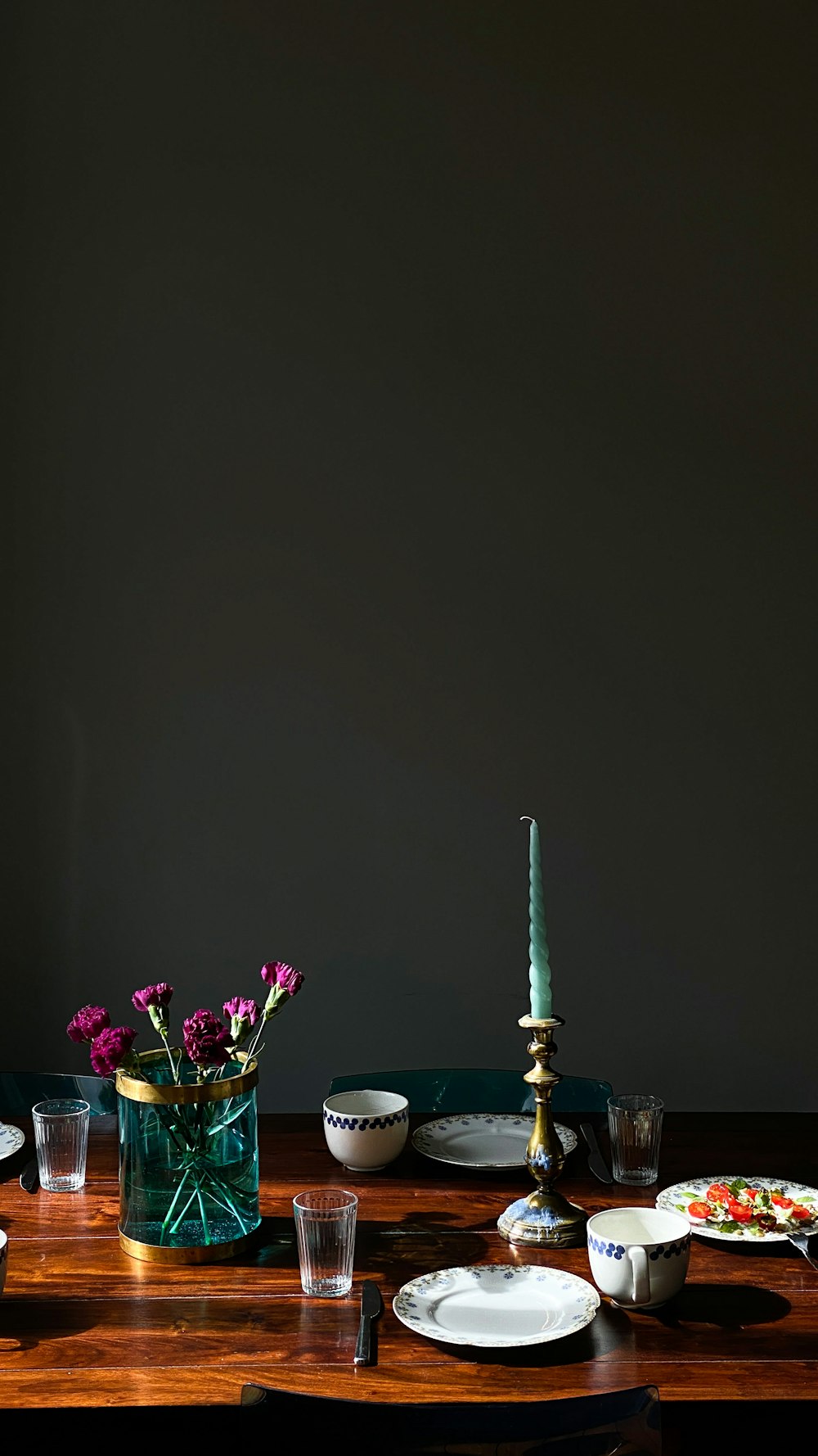 a table with plates and cups