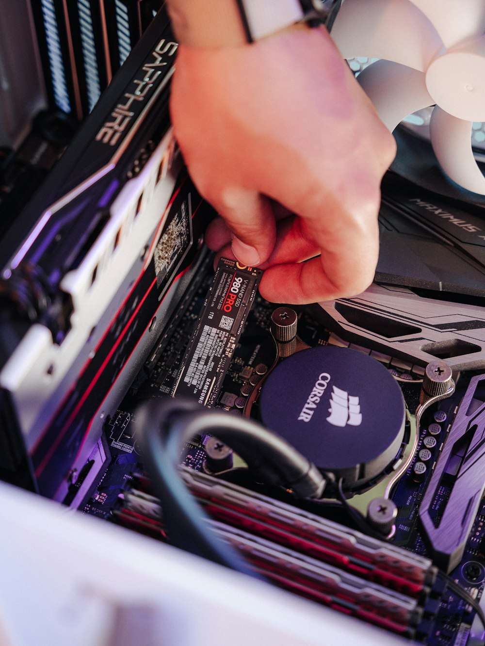 a person holding a computer chip