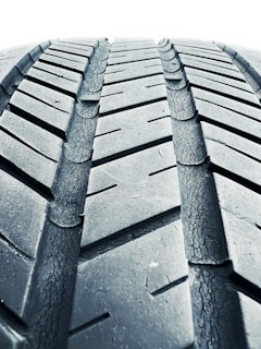 A detailed view of a motorcycle tire with tread patterns.
