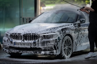 a person standing next to a car