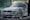 a person standing next to a car