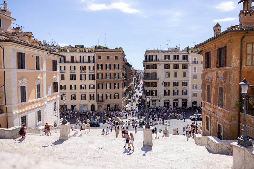 a group of buildings with people walking around