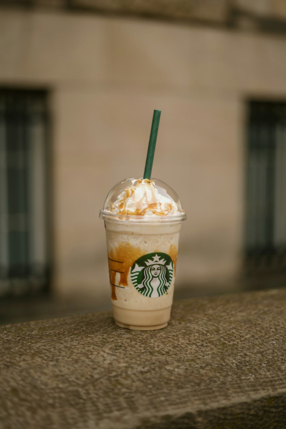 a cup with a straw and a straw on a counter